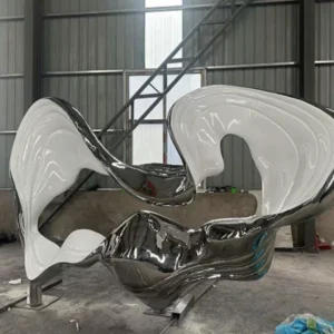 Multi-faceted polished surface detail of custom metal landscape sculpture