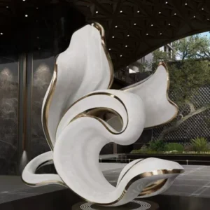 Outdoor abstract metal sculpture installed in commercial plaza