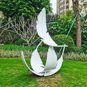 Outdoor feather metal sculpture installed in public plaza