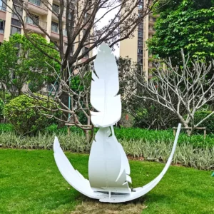 Side view of stainless steel feather landscape sculpture